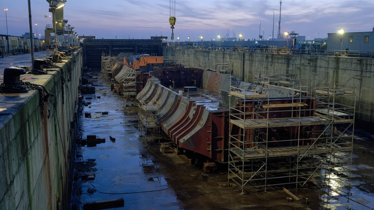 Shipyard dry dock and hull blocks at dusk — site context for Mission Control
